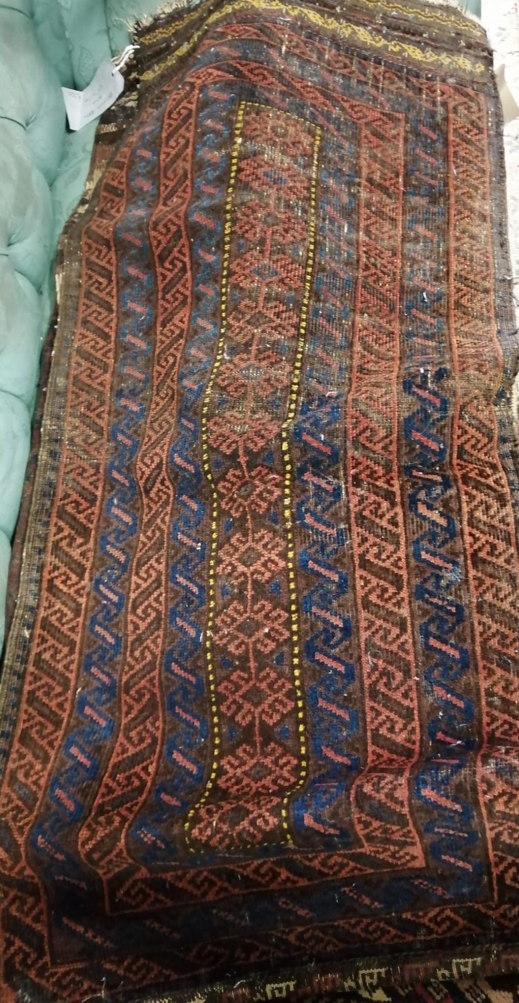 Six antique Belouch bags and faces, largest 200 x 52cm